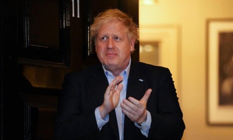 Boris Johnson clapping to support NHS workers outside Downing Street last week, prior to his own admission to hospital.