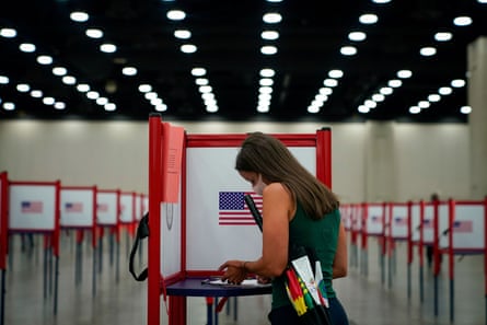 Woman casts ballot
