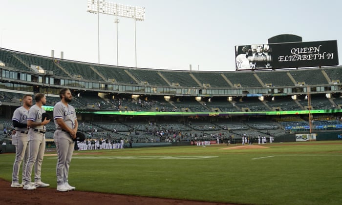 Chicago White Sox players stand for a tribute to Queen Elizabeth II, Britain’s longest reigning monarch.