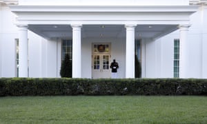 A Marine stands guard outside the West Wing, where Trump is still supposedly under quarantine.