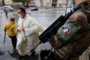 Cambrai, FranceA French soldier stands guard in front of the cathedral during the All Saints Day mass, as the country has raised the security alert for its territory to the highest level after the knife attack in the city of Nice