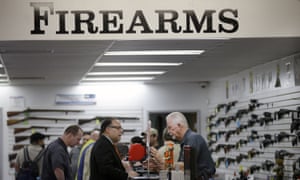 Sales associate Mike Conway, right, shows Paul Angulo guns at Bullseye Sport gun shop in Riverside, California, on 9 December 2015. The state has strict policies on gun control. 3000.jpg?width=300&quality=85&auto=forma