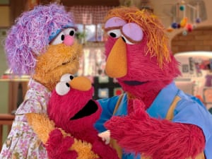 Sesame Street’s Elmo with his parents.
