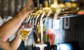 barman hand at beer tap pouring draught lager beer serving in a restaurant or pub.<br>J04M98 barman hand at beer tap pouring draught lager beer serving in a restaurant or pub.