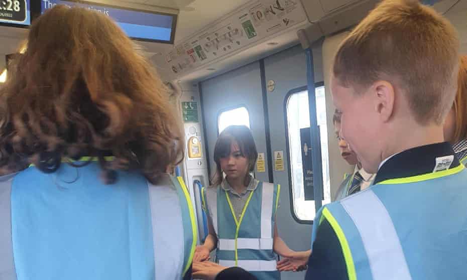 Pupils from Hatcham Temple Grove free school in Nunhead on the stranded train