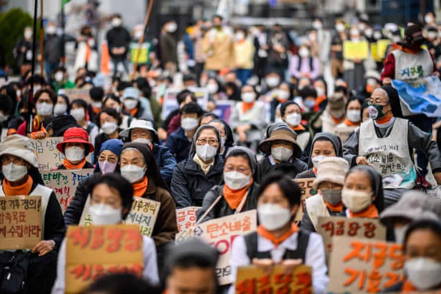 People participate in a rally during a global day of action on climate change in Seoul on November 6, 2021, as world leaders attend the COP26 UN Climate Change Conference in Glasgow.