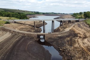 Low water levels have exposed a normally submerged bridge at Baitings reservoir in West Yorkshire