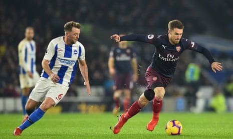 Arsenal’s sub and birthday boy Aaron Ramsey surges forward with the ball past Brighton’s Dale Stephens.