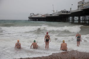 GB. England. Brighton. Members of the Sea Swimming Club who meet daily to swim in the sea. 2010.