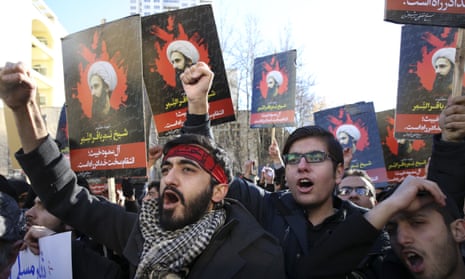 Iranian demonstrators chant slogans during a protest denouncing the execution of Sheikh Nimr al-Nimr