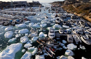 Ice floats around boats in the port of Ilulissat. Greenland is experiencing one of its biggest ice-melt years in recorded history.