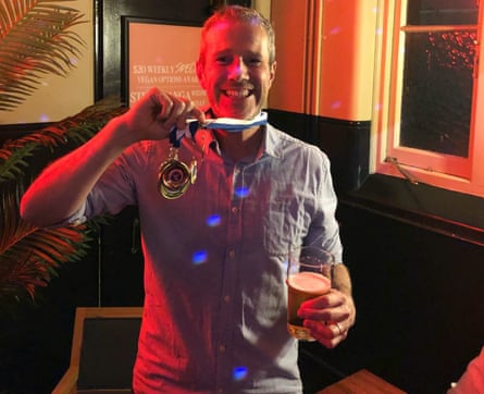 Guardian writer/podcaster and player for Melbourne University SC Bohemians, Max Rushden shows off a medal.
