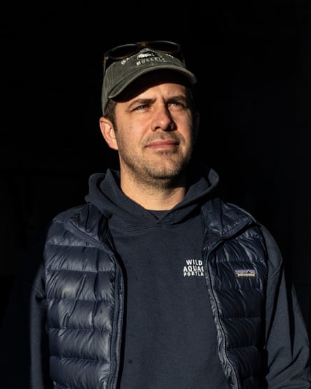 Portrait of Matt Moretti wearing a cap and hooded sweater