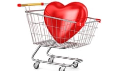 shopping cart and heart on white background. Isolated 3D illustration