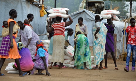Women carry maize flour sacks