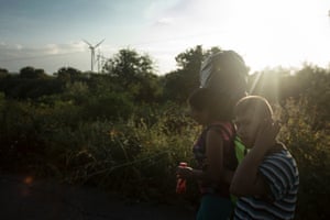 Marie Caseres and her son Javier on the road.