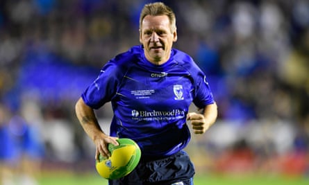 Stuart Pearce on the pitch at half-time in a Warrington Wolves match in 2019.