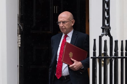John Healey leaves 10 Downing Street.
