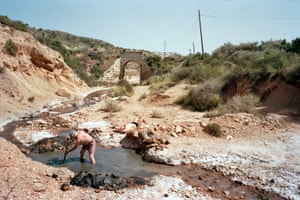 Near Alicante there is an area famous for its medicinal waters. People build rafts and small dams to retain some of the water and use them as pools to bathe in