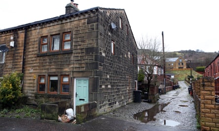 A side road which floods after much rainfall next to a house in Todmorden.