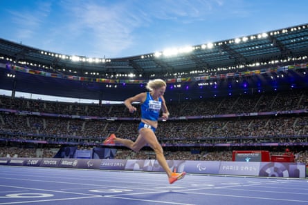 Valentina Petrillo crosses the line in the women’s T12 200m semi-final.