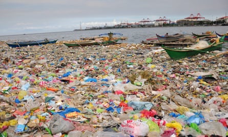 Manila Bay in the Philippines covered with plastic bags and rubbish.