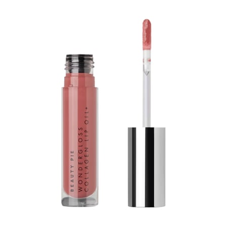 Beige-pink lip oil in cylinder with sponge applicator