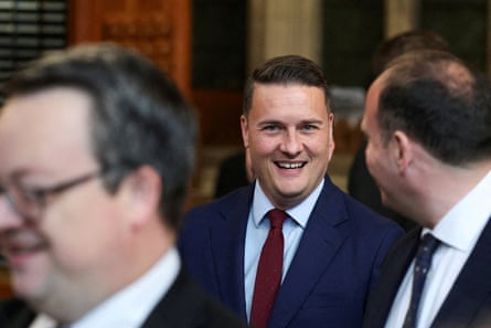 Wes Streeting smiling among other MPs