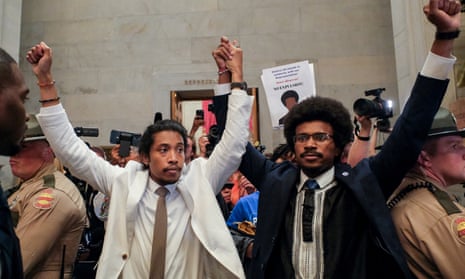 Justin Pearson and Justin Jones raise their hands after being expelled from their seats in Nashville, Tennessee, 6 April 2023.