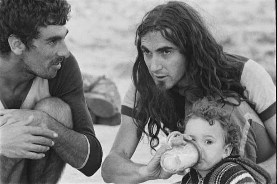 The singer-songwriter Pau Riba with his son in a town of Formentera
