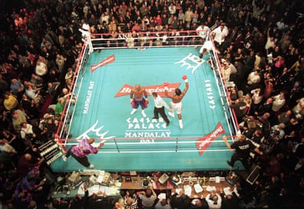 Lennox Lewis celebrates at the final bell of his rematch against Evander Holyfield in Las Vegas.