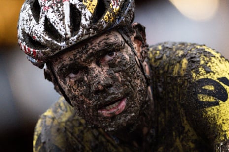 A mud-covered Wout van Aert competes during the UCI Cyclocross World Cup in Dendermonde.