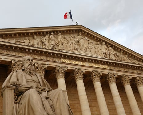 A French flag flies atop the National Assembly on the day French prime minister François Bayrou seeks a confidence vote in parliament on the budget issue, in Paris, France.