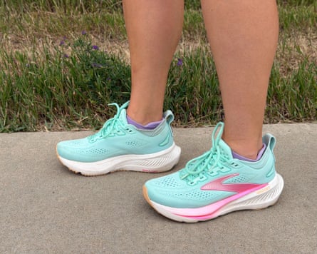 A person standing on a sidewalk in brooks glycerin 23 shoes