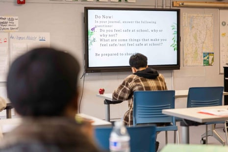 students sit in class