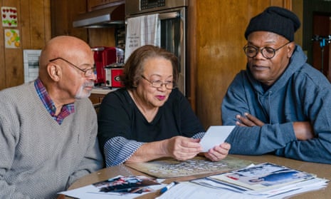 Samuel L Jackson (right) looks over a family tree with his cousins Arthur and Hilda.