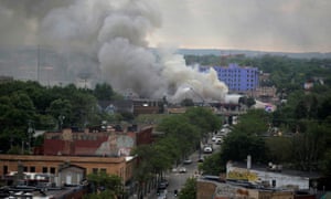 Plumes of smoke rise in the aftermath of a protest in Minneapolis, Minnesota, on Friday.