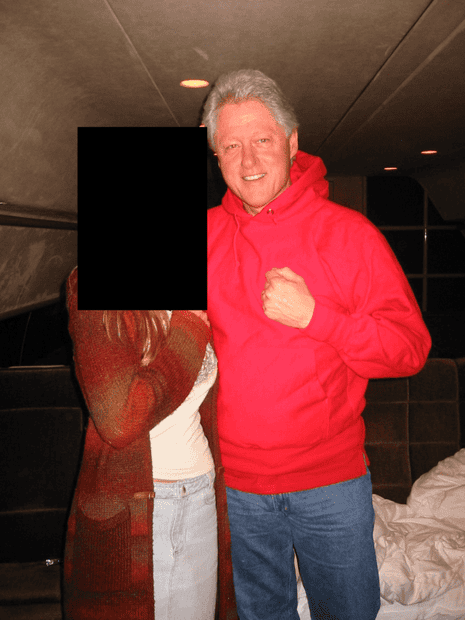 Bill Clinton pictured with a woman whose face is redacted.