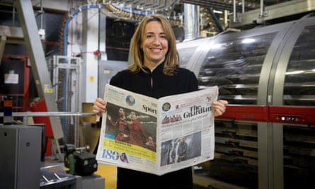 Guardian editor-in-chief Katharine Viner holding the first tabloid copy of the Guardian.