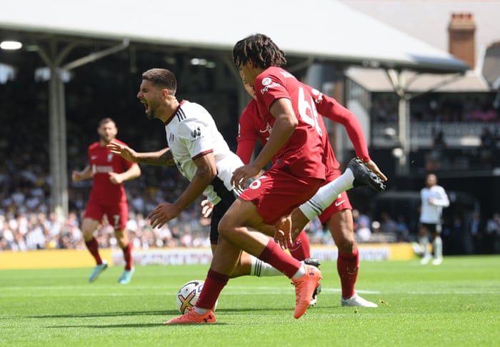 Aleksandar Mitrovic of Fulham is fouled whilst being challenged by Liverpool’s Virgil van Dijk as Trent Alexander-Arnold looks on. The challenge resulted in a penalty being given.