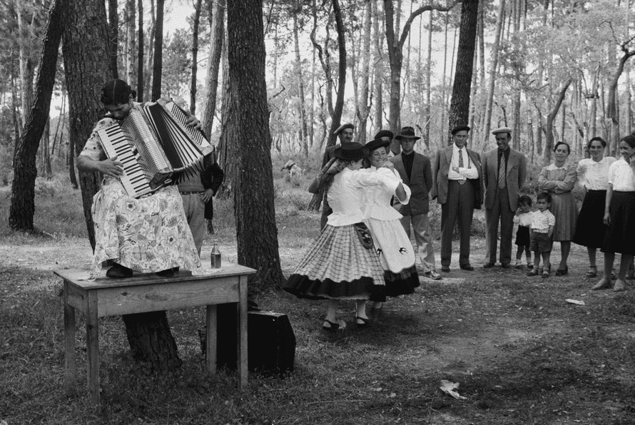 People dance while an accordion plays
