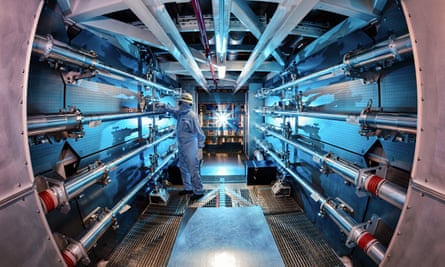 In this 2012 image provided by Lawrence Livermore National Laboratory, a technician reviews an optic inside the preamplifier support structure.