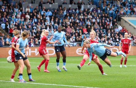 Rebecca Knaak heads home Manchester City’s late winner against Liverpool