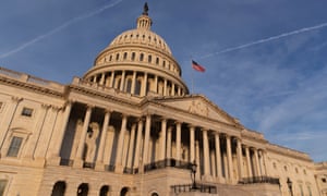 The US Capitol Building at sunrise.