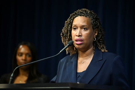 a woman speaks into a microphone