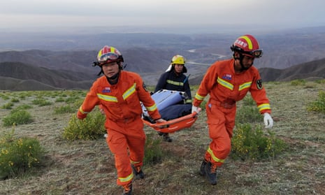Rescue workers at the site of the ultramarathon where extreme cold weather killed participants  near Baiyin city