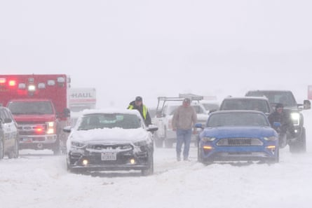 Police and emergency workers try to free vehicles from the snow on Mountain View Parkway in Lehi, Utah, on Wednesday.