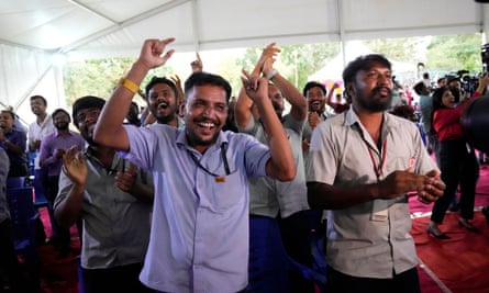 ISRO staff celebrate the successful landing of Chandrayaan-3 on the moon at the command facility in Bengaluru.