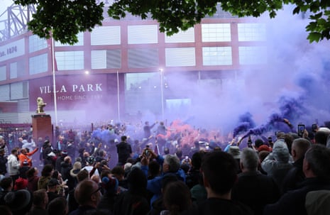 Aston Villa fans with flares outside the stadium before their Premier League match against Liverpool.