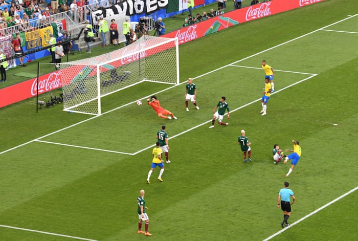 Mexico’s keeper Guillermo Ochoa thwarts Philippe Coutinho.